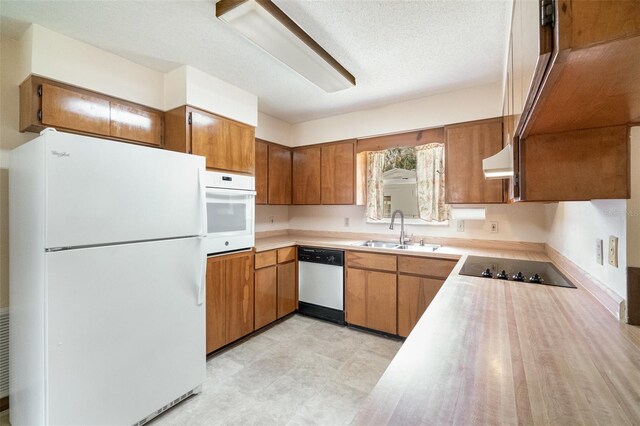 201 W New York Ave, Orange City, FL 32763 - kitchen featuring white appliances, brown cabinetry, light countertops, and ventilation hood