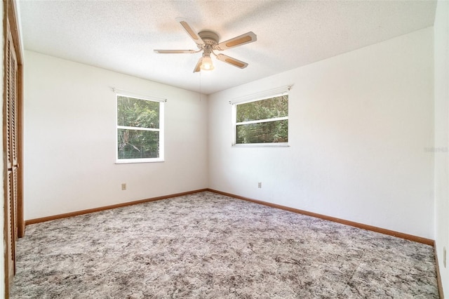 201 W New York Ave, Orange City, FL 32763 - spare room featuring carpet, ceiling fan, and a textured ceiling