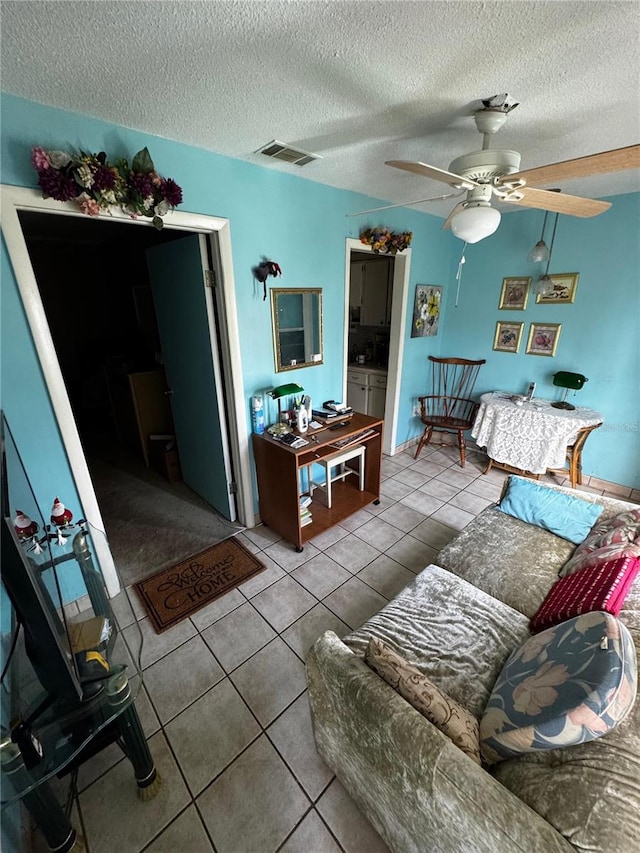 5247 81st St N Unit 2, Saint Petersburg, FL 33709 - tiled living area with a ceiling fan and a textured ceiling