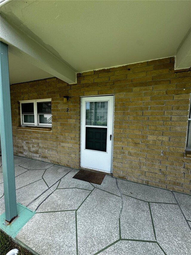 5247 81st St N Unit 2, Saint Petersburg, FL 33709 - entrance to property with a patio and brick siding