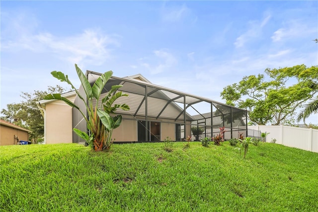 826 Addison Dr NE, Saint Petersburg, FL 33716 - back of property with glass enclosure and stucco siding