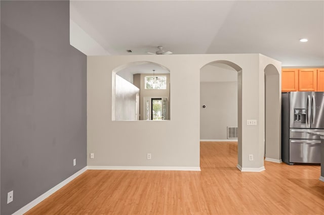 826 Addison Dr NE, Saint Petersburg, FL 33716 - spare room featuring light wood finished floors, recessed lighting, and arched walkways