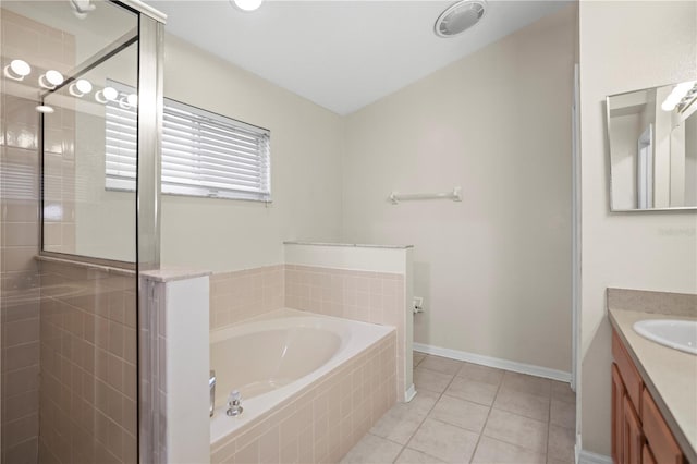 826 Addison Dr NE, Saint Petersburg, FL 33716 - bathroom with vanity, a stall shower, a bath, and tile patterned floors