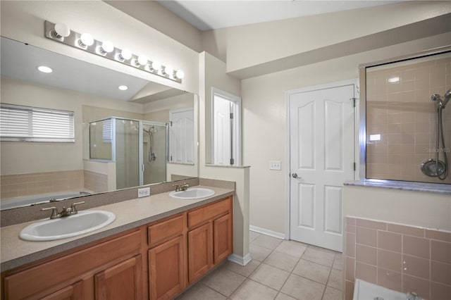 826 Addison Dr NE, Saint Petersburg, FL 33716 - bathroom featuring a shower stall, tile patterned floors, a garden tub, and double vanity