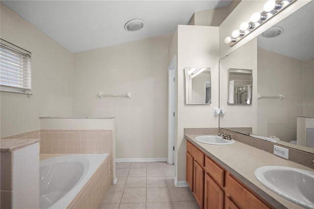 826 Addison Dr NE, Saint Petersburg, FL 33716 - full bathroom with a garden tub, double vanity, and tile patterned flooring