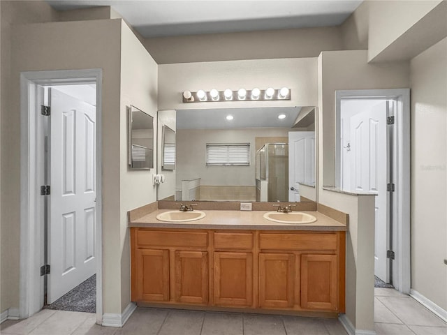 826 Addison Dr NE, Saint Petersburg, FL 33716 - bathroom with a shower stall, tile patterned floors, and double vanity