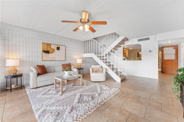 2424 W Tampa Bay Blvd Unit G204, Tampa, FL 33607 - tiled living area featuring a ceiling fan and stairway