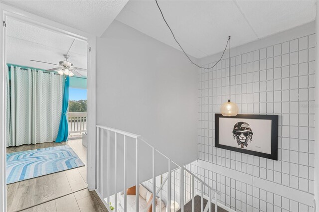 2424 W Tampa Bay Blvd Unit G204, Tampa, FL 33607 - stairway with ceiling fan and wood finished floors