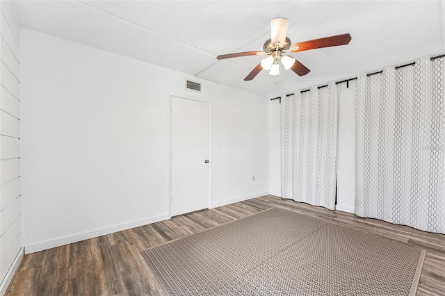 2424 W Tampa Bay Blvd Unit G204, Tampa, FL 33607 - unfurnished room featuring ceiling fan and wood finished floors