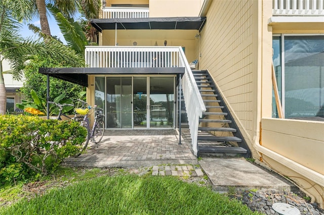 2424 W Tampa Bay Blvd Unit G204, Tampa, FL 33607 - rear view of property with stairs and a patio