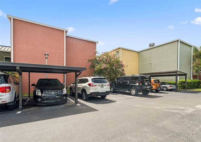 2424 W Tampa Bay Blvd Unit G204, Tampa, FL 33607 - view of partially covered parking lot