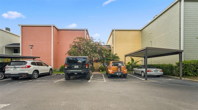 2424 W Tampa Bay Blvd Unit G204, Tampa, FL 33607 - view of partially covered parking lot
