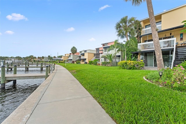 2424 W Tampa Bay Blvd Unit G204, Tampa, FL 33607 - surrounding community featuring a lawn, a dock, a water view, and a residential view