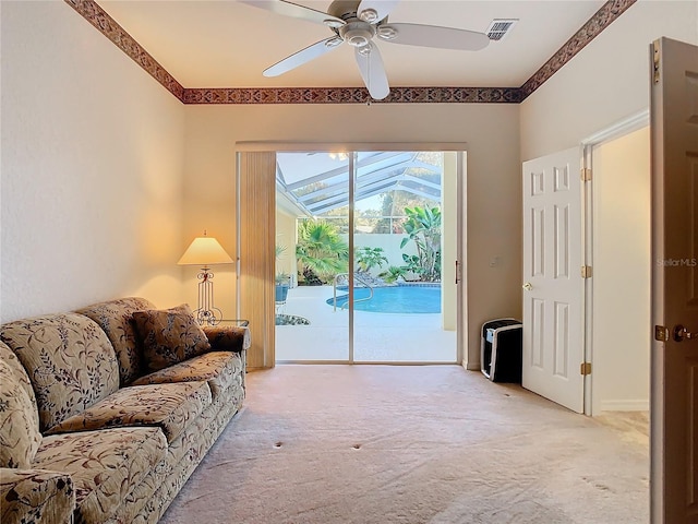 11620 Eastern Star Ct, New Port Richey, FL 34654 - living room with light colored carpet and ceiling fan