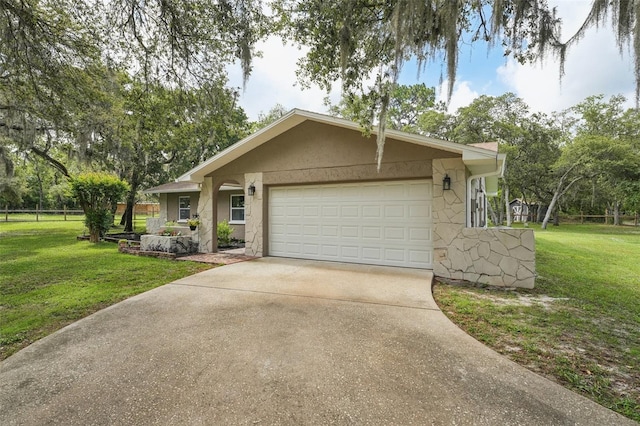 10614 Hudson Ave, Hudson, FL 34669 - ranch-style home with concrete driveway, an attached garage, stone siding, and stucco siding