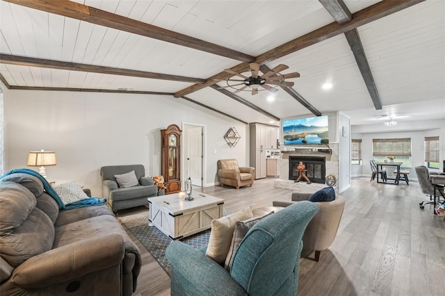 10614 Hudson Ave, Hudson, FL 34669 - living room with ceiling fan, wood finished floors, a fireplace, baseboards, and wood ceiling