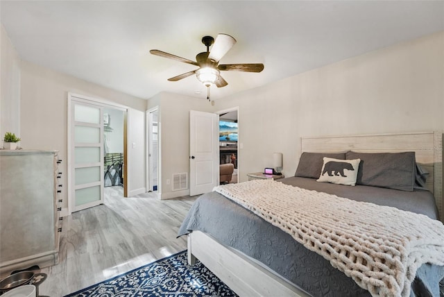 10614 Hudson Ave, Hudson, FL 34669 - bedroom featuring light wood-type flooring, ceiling fan, and baseboards