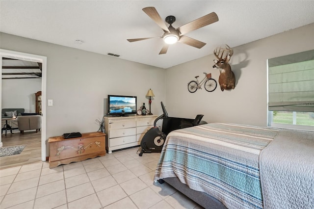 10614 Hudson Ave, Hudson, FL 34669 - bedroom featuring a ceiling fan and light tile patterned floors