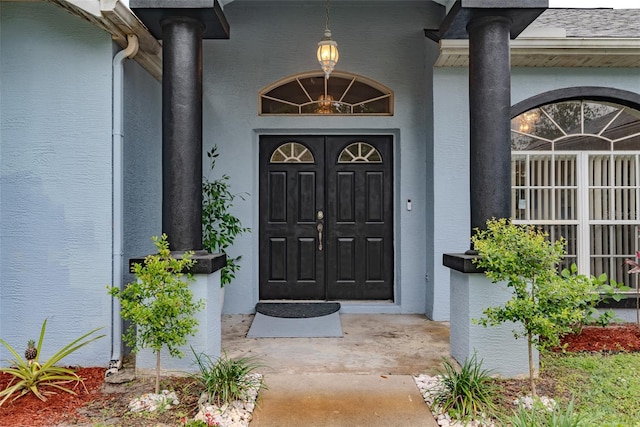 22946 Brownwood Ct, Land O Lakes, FL 34639 - doorway to property with stucco siding