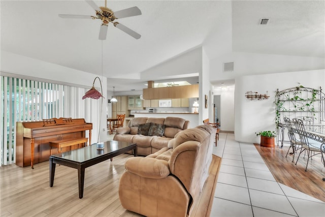 22946 Brownwood Ct, Land O Lakes, FL 34639 - living room with ceiling fan, high vaulted ceiling, and light tile patterned flooring