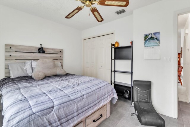 22946 Brownwood Ct, Land O Lakes, FL 34639 - bedroom featuring a closet and a ceiling fan