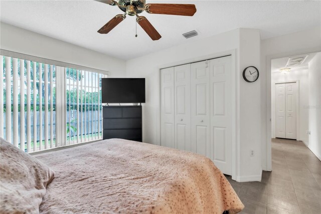 22946 Brownwood Ct, Land O Lakes, FL 34639 - bedroom with a closet and ceiling fan