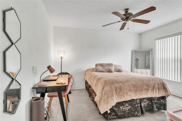 22946 Brownwood Ct, Land O Lakes, FL 34639 - bedroom with tile patterned floors, a ceiling fan, and a textured ceiling