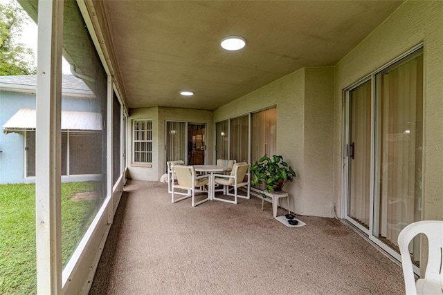 22946 Brownwood Ct, Land O Lakes, FL 34639 - sunroom / solarium with carpet, outdoor dining area, recessed lighting, and a textured wall