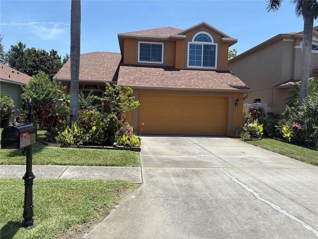 1855 Briland St, Tarpon Springs, FL 34689 - traditional-style home featuring concrete driveway, stucco siding, an attached garage, and a front lawn