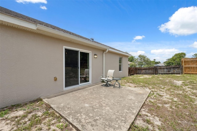 13238 Asbury St, Spring Hill, FL 34609 - fenced backyard featuring a patio area