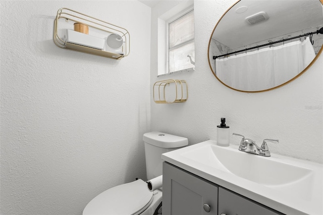 4922 Bola St, New Port Richey, FL 34652 - bathroom featuring vanity, a textured wall, and a shower with shower curtain