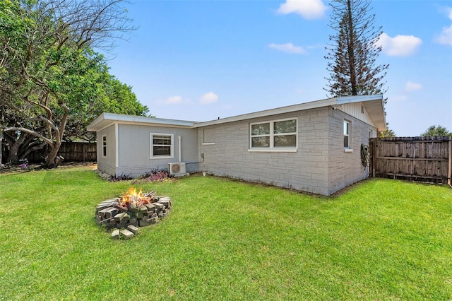 4922 Bola St, New Port Richey, FL 34652 - back of property with an outdoor fire pit and a fenced backyard