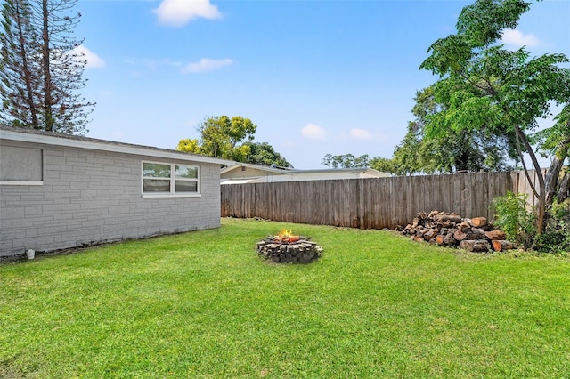 4922 Bola St, New Port Richey, FL 34652 - view of yard featuring an outdoor fire pit