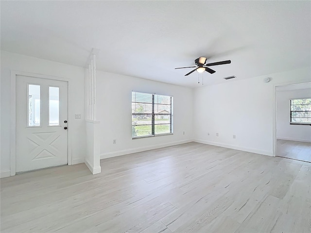 21426 Quesada Ave, Port Charlotte, FL 33952 - foyer entrance with light wood-style floors and ceiling fan