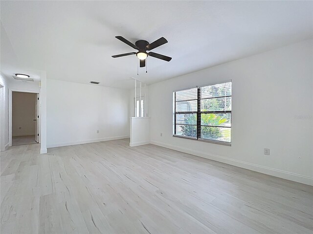 21426 Quesada Ave, Port Charlotte, FL 33952 - spare room with a ceiling fan and light wood-style flooring