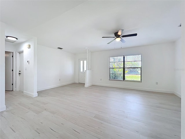 21426 Quesada Ave, Port Charlotte, FL 33952 - empty room with light wood finished floors and ceiling fan