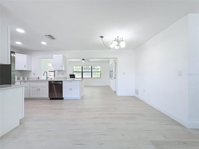 21426 Quesada Ave, Port Charlotte, FL 33952 - kitchen featuring appliances with stainless steel finishes, light wood-style flooring, a chandelier, light countertops, and recessed lighting