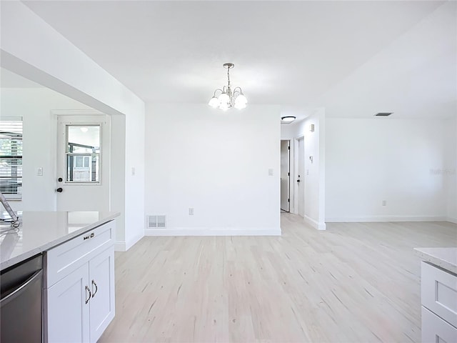 21426 Quesada Ave, Port Charlotte, FL 33952 - unfurnished dining area featuring a chandelier and light wood finished floors