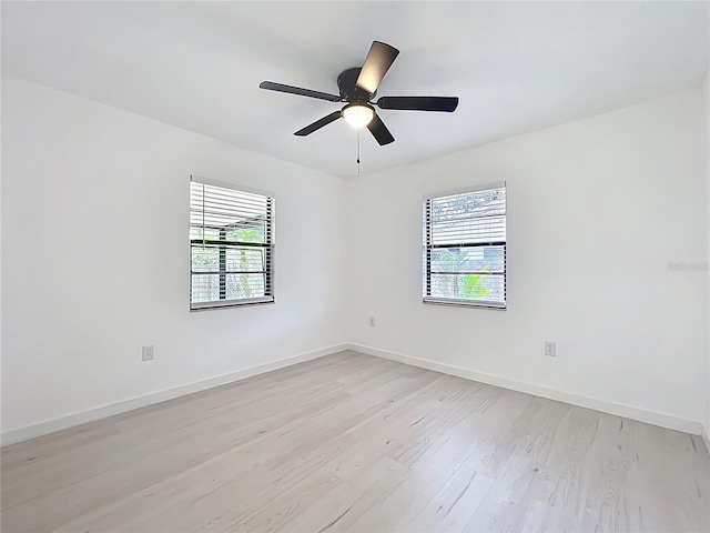 21426 Quesada Ave, Port Charlotte, FL 33952 - empty room with light wood-type flooring, healthy amount of natural light, and a ceiling fan