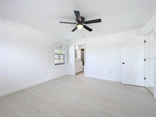 21426 Quesada Ave, Port Charlotte, FL 33952 - unfurnished bedroom with connected bathroom, light wood-type flooring, and ceiling fan