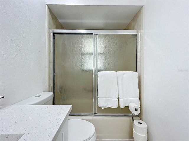 21426 Quesada Ave, Port Charlotte, FL 33952 - bathroom featuring vanity, combined bath / shower with glass door, and a textured wall