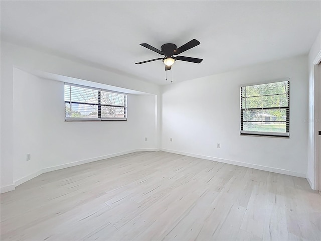 21426 Quesada Ave, Port Charlotte, FL 33952 - empty room featuring light wood finished floors, plenty of natural light, and ceiling fan