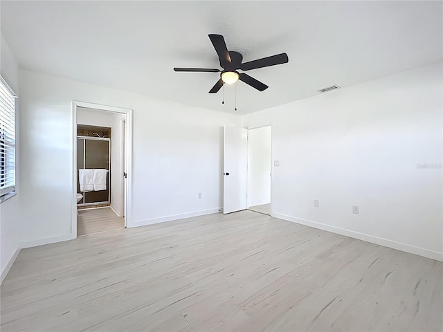 21426 Quesada Ave, Port Charlotte, FL 33952 - unfurnished bedroom with light wood finished floors, a ceiling fan, and ensuite bath