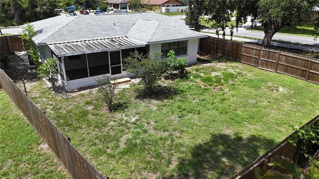 21426 Quesada Ave, Port Charlotte, FL 33952 - fenced backyard featuring a sunroom