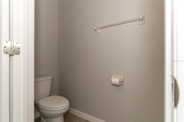 2801 Midnight Pearl Dr, Sarasota, FL 34240 - bathroom with toilet, tile patterned flooring, and baseboards