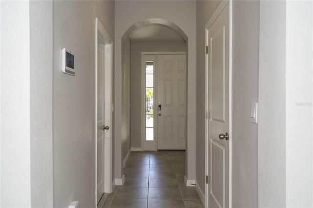 2801 Midnight Pearl Dr, Sarasota, FL 34240 - tiled entrance foyer featuring arched walkways and baseboards