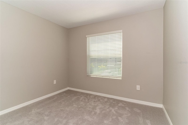 2801 Midnight Pearl Dr, Sarasota, FL 34240 - carpeted spare room featuring baseboards