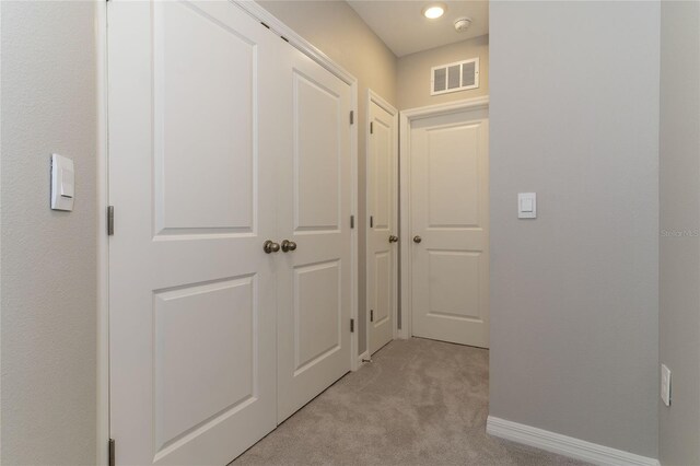 2801 Midnight Pearl Dr, Sarasota, FL 34240 - hallway with light colored carpet and baseboards