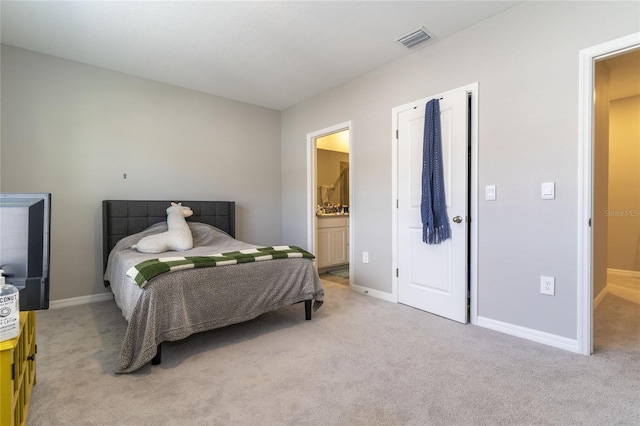 2801 Midnight Pearl Dr, Sarasota, FL 34240 - bedroom featuring light carpet, baseboards, and ensuite bath