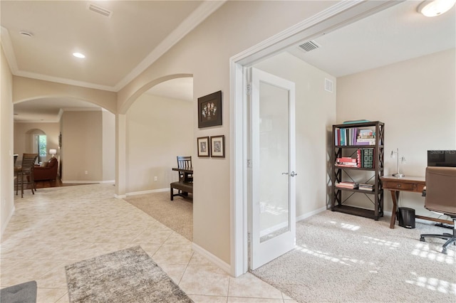 19418 Butterwood Ln, Lutz, FL 33558 - home office with arched walkways, ornamental molding, baseboards, light tile patterned floors, and light colored carpet